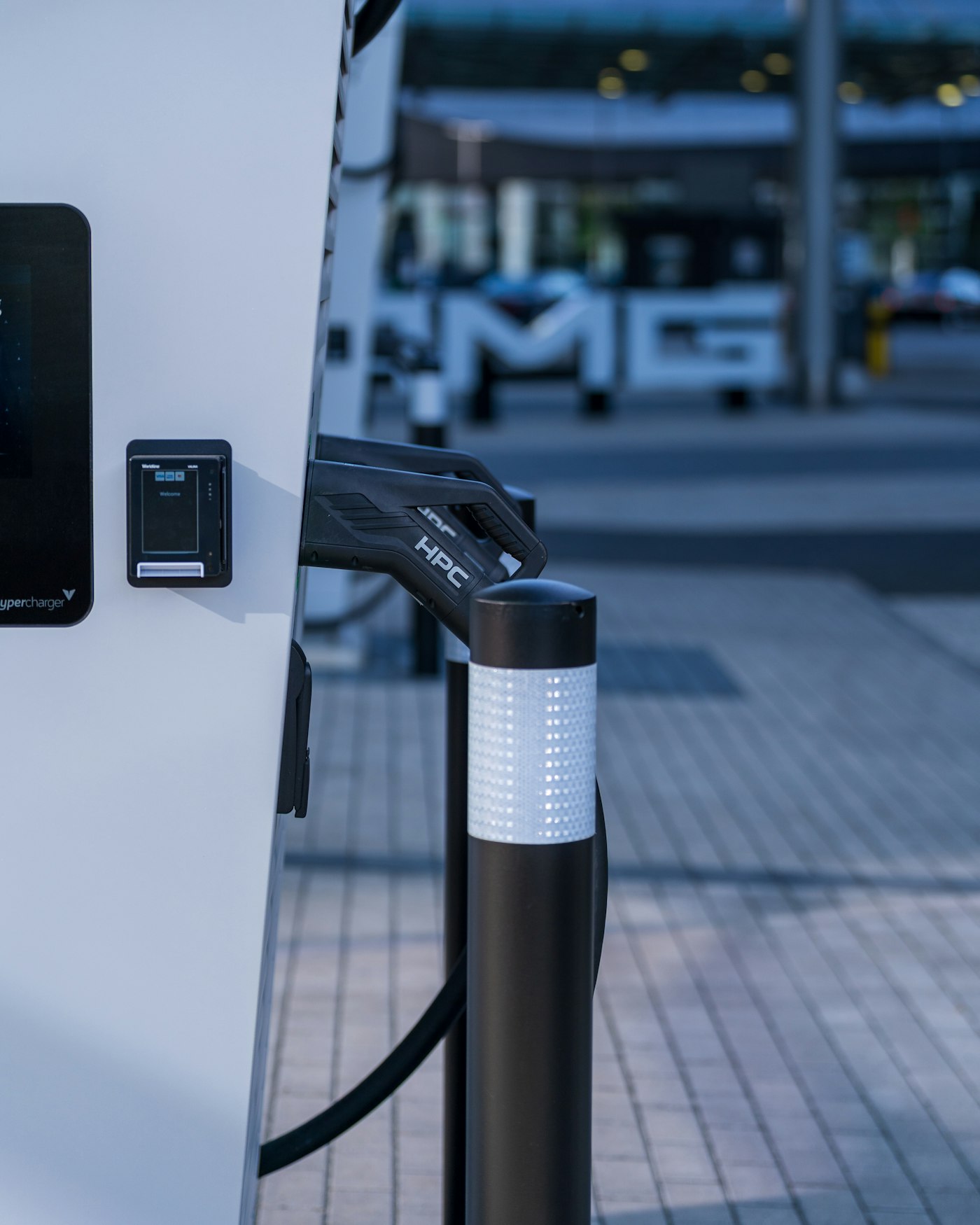 Electric vehicle plugged in at a charging station